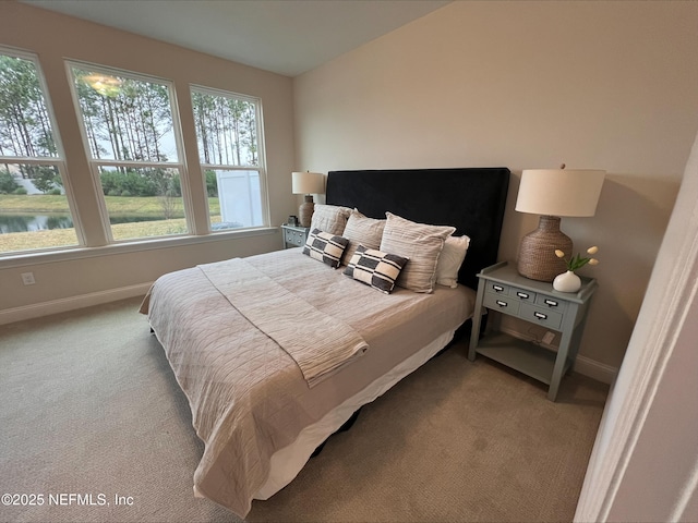 carpeted bedroom with baseboards