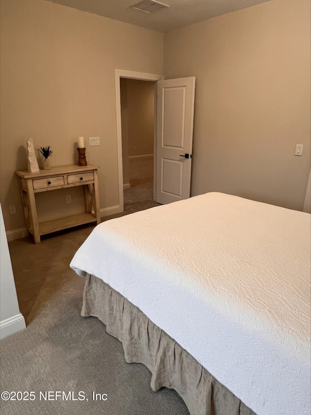 carpeted bedroom featuring baseboards