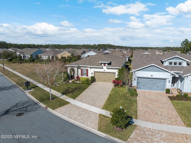 view of front of house with a garage and a front yard