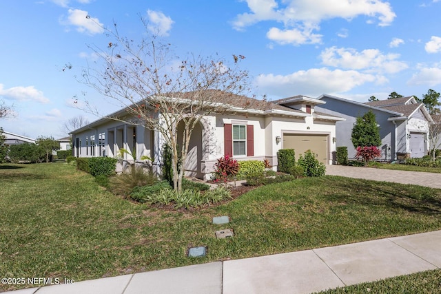 view of front facade with a front yard and a garage