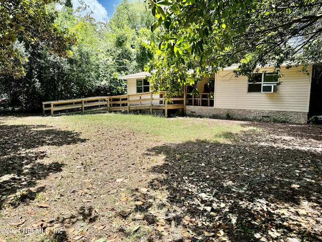 view of yard with a wooden deck