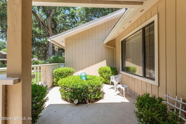 view of property exterior featuring covered porch