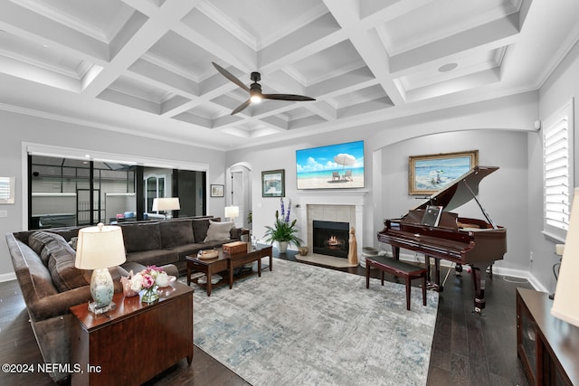 living room featuring dark hardwood / wood-style floors, beam ceiling, crown molding, and coffered ceiling