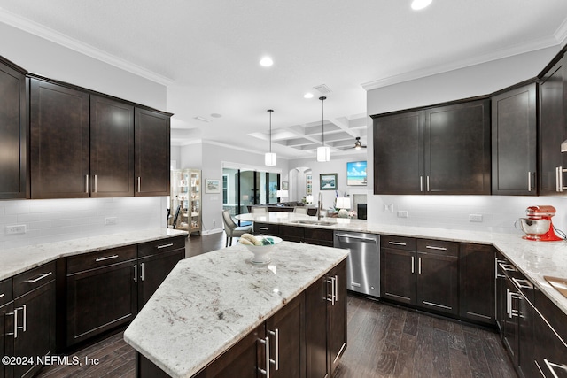 kitchen featuring sink, stainless steel dishwasher, dark hardwood / wood-style floors, decorative light fixtures, and ornamental molding