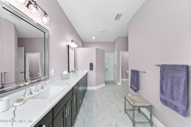 bathroom featuring a shower and vanity