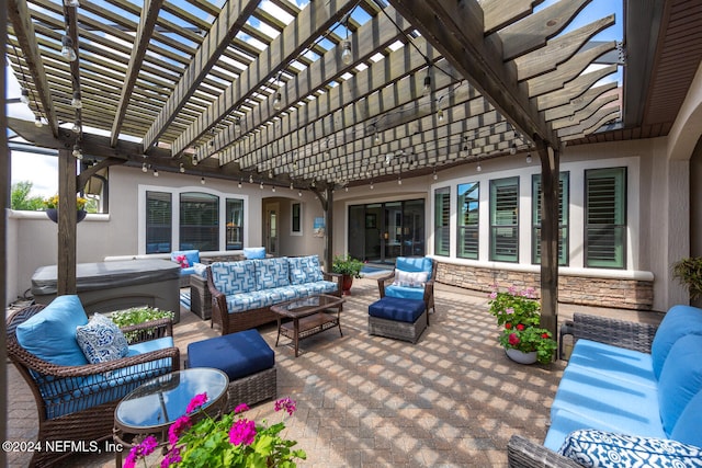 view of patio / terrace featuring a pergola, a hot tub, and an outdoor hangout area