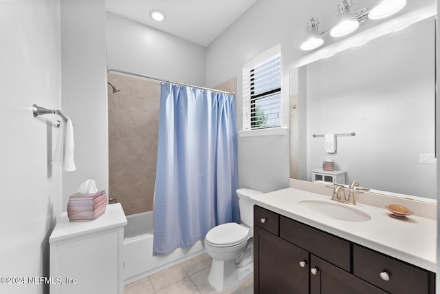 full bathroom featuring tile patterned floors, shower / bath combo, toilet, and vanity