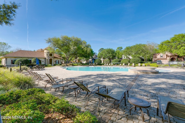 view of swimming pool with a patio area