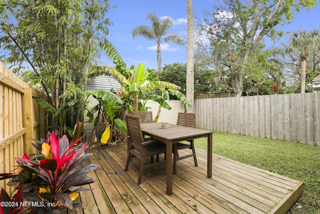 wooden deck with a yard