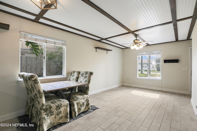 dining room featuring beam ceiling, light wood-type flooring, and ceiling fan