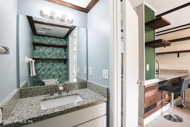 bathroom with vanity and toilet