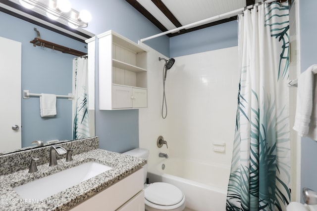 full bathroom featuring shower / bath combo with shower curtain, vanity, and toilet