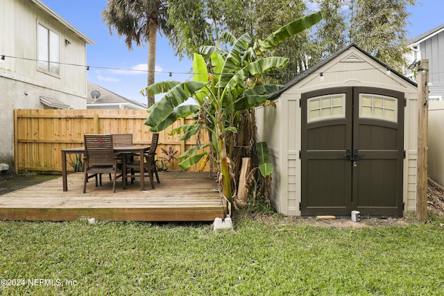 view of outbuilding with a yard