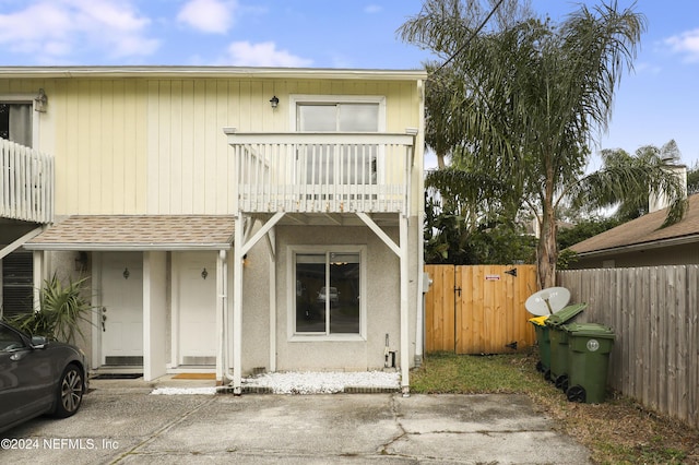 view of front of property with a balcony