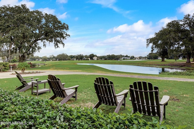 surrounding community featuring a yard and a water view