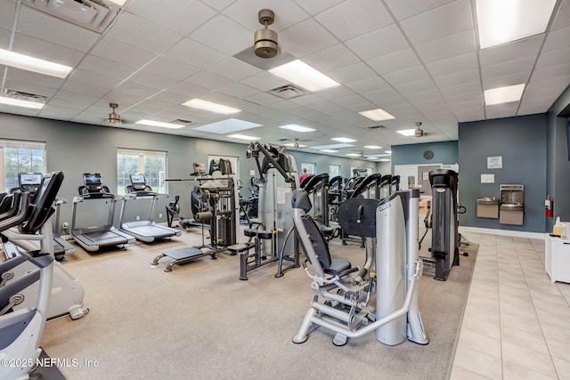 workout area featuring a paneled ceiling