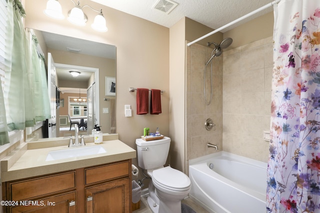 full bathroom featuring shower / bath combo, vanity, a textured ceiling, and toilet