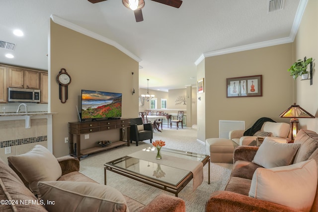 living room featuring ceiling fan with notable chandelier, sink, ornamental molding, and light carpet