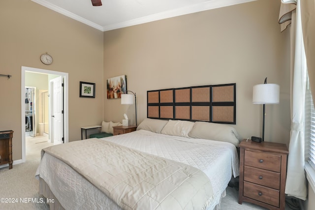 bedroom with light carpet, crown molding, and ceiling fan