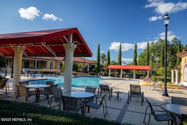 view of swimming pool featuring a patio area