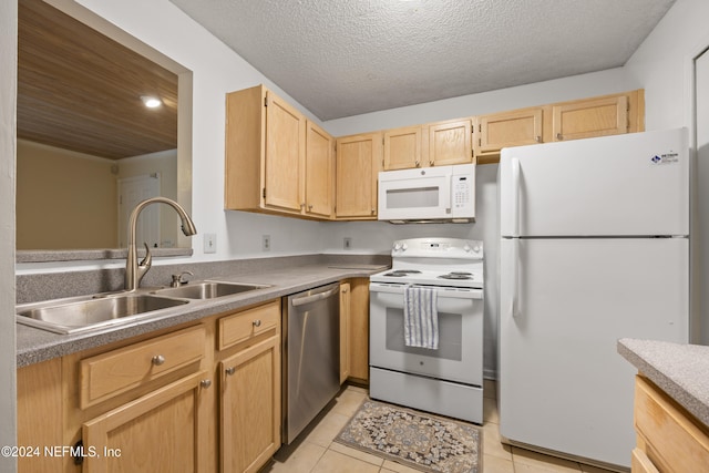 kitchen featuring light brown cabinetry, white appliances, a textured ceiling, sink, and light tile patterned flooring