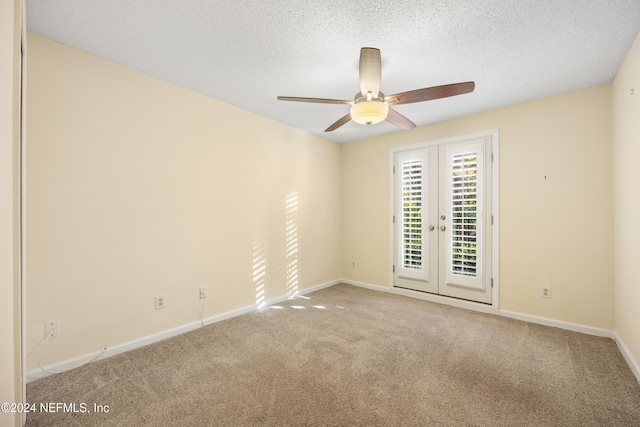 spare room featuring carpet flooring, ceiling fan, a textured ceiling, and french doors