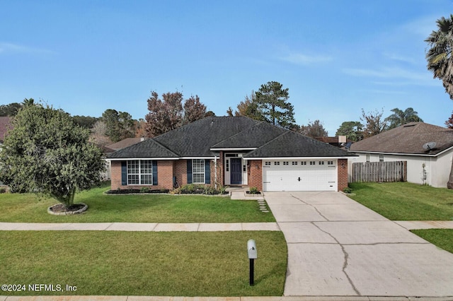 single story home featuring a front yard and a garage