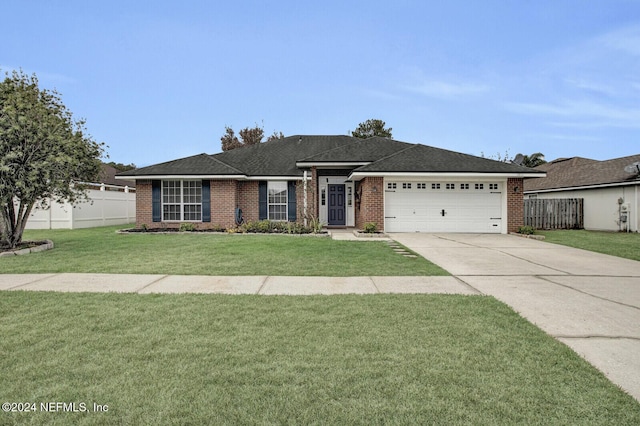 ranch-style home featuring a garage and a front yard