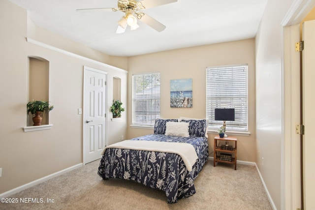 bedroom featuring ceiling fan, baseboards, and carpet floors