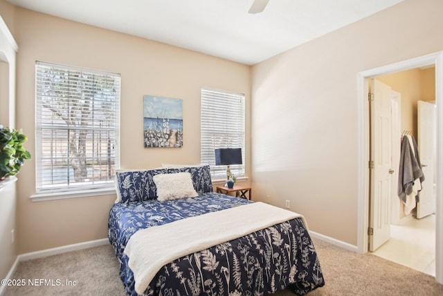 carpeted bedroom featuring baseboards and ceiling fan