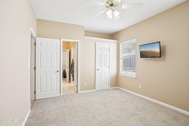 unfurnished bedroom with carpet, baseboards, a closet, and ceiling fan