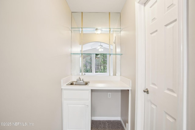 bathroom featuring vanity and a ceiling fan