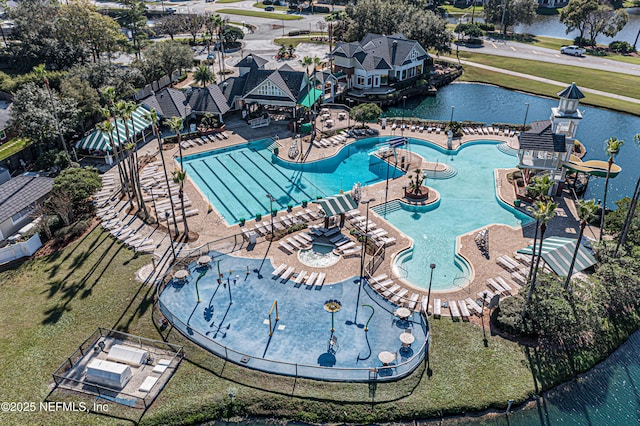 birds eye view of property with a water view