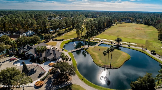 bird's eye view with view of golf course, a forest view, and a water view