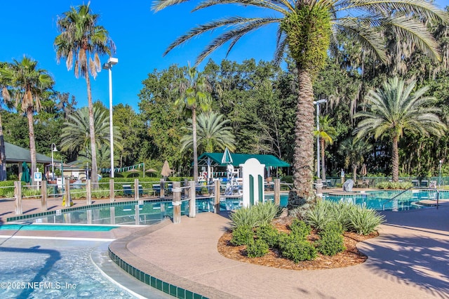 community pool featuring fence