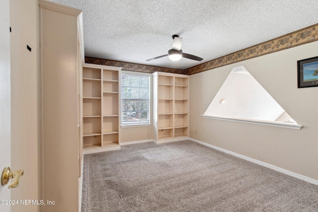 spare room with light carpet, a textured ceiling, and ceiling fan