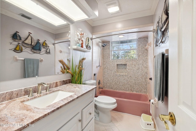 full bathroom with vanity, tile patterned floors, tiled shower / bath combo, toilet, and ornamental molding