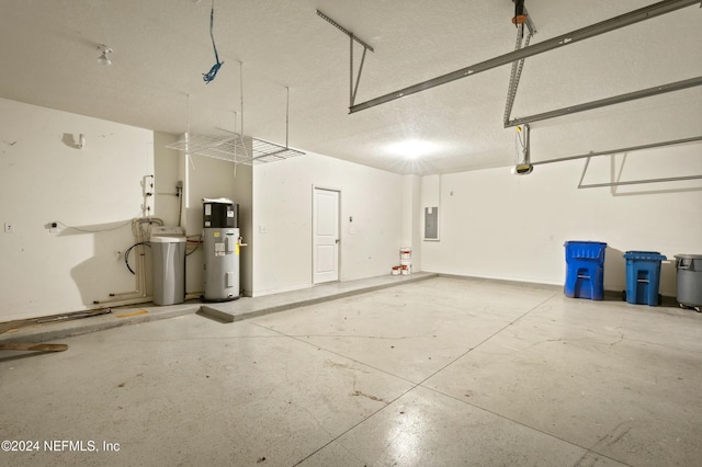 garage featuring electric panel and heat pump water heater