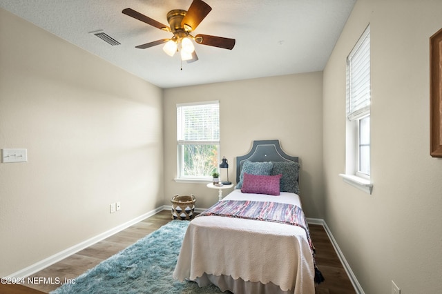 bedroom featuring hardwood / wood-style floors and ceiling fan