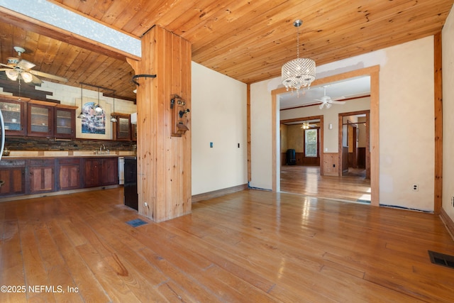 interior space featuring sink, light hardwood / wood-style flooring, wooden ceiling, and ceiling fan