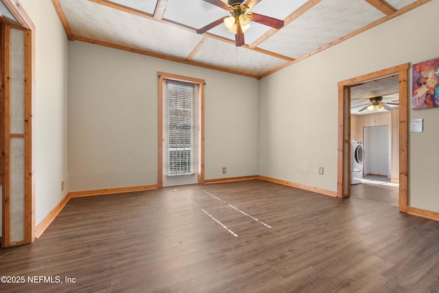 unfurnished room featuring ceiling fan, ornamental molding, dark hardwood / wood-style floors, and washer / dryer