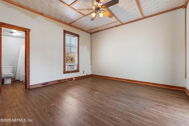 spare room with hardwood / wood-style floors, ceiling fan, and cooling unit