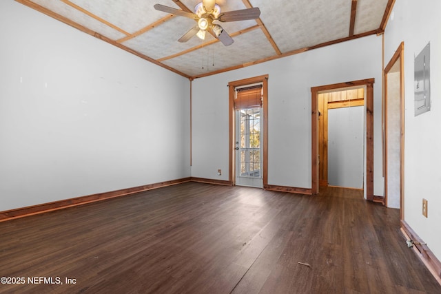 unfurnished room with ceiling fan, dark hardwood / wood-style flooring, and electric panel