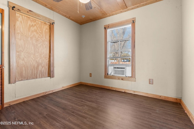 unfurnished room with wood ceiling, ceiling fan, dark hardwood / wood-style floors, and cooling unit