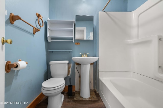 full bathroom featuring sink, shower / washtub combination, toilet, and hardwood / wood-style floors