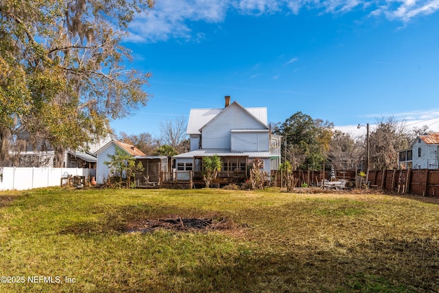 view of yard featuring a sunroom