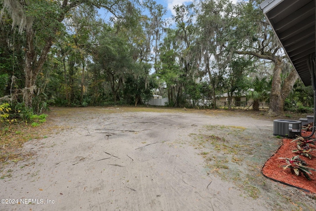 view of yard featuring central AC unit