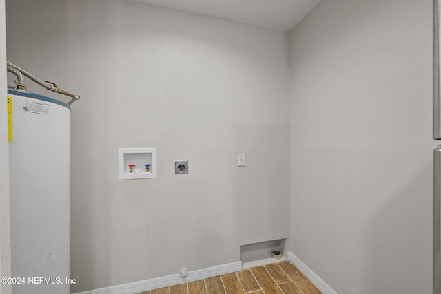 laundry area featuring hardwood / wood-style flooring, hookup for a washing machine, water heater, and hookup for an electric dryer