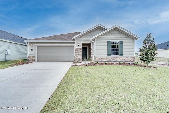 craftsman-style home with a front yard and a garage