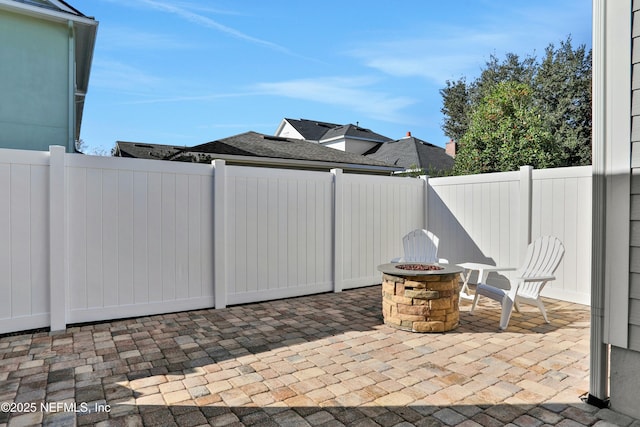 view of patio / terrace with a fire pit